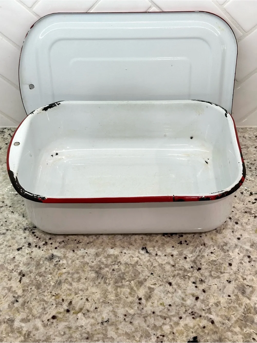 Vintage white enamel pan with red trim